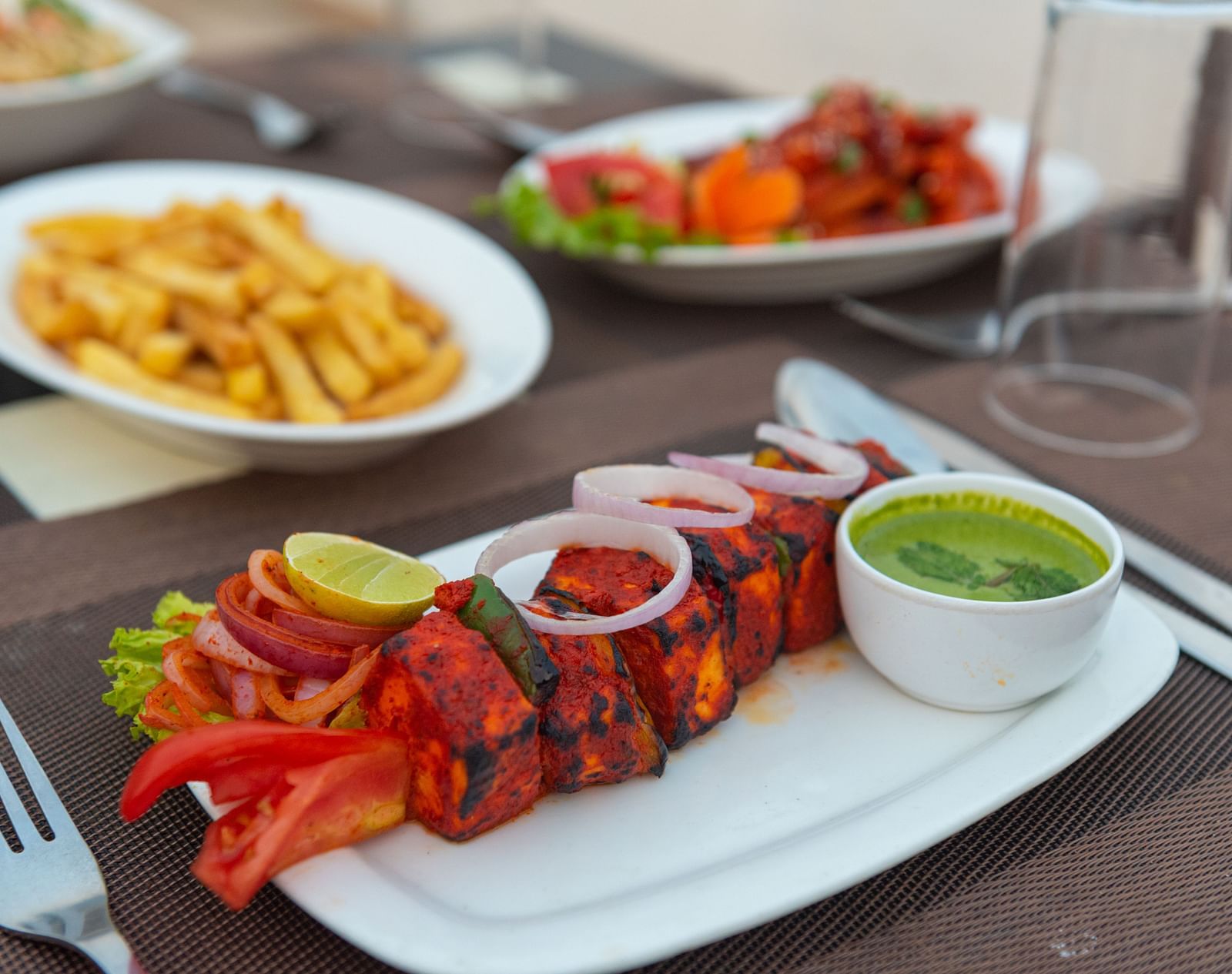 Paneer tikka served with fresh green chutney at DLS The Classio